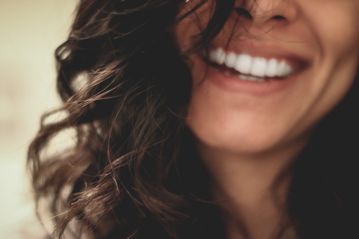 Person with a bright white smile after teeth whitening at Clarenville Dental Care